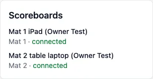 Scoreboards: Mat 1 iPad (Owner Test) on Mat 1 connected, and Mat 2 table laptop (Owner Test) on Mat 2 connected